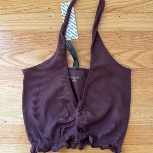 Out from under stretchy purple halter top